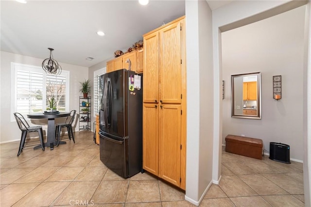 kitchen with freestanding refrigerator, baseboards, recessed lighting, and light tile patterned floors