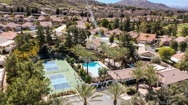 birds eye view of property with a mountain view and a residential view