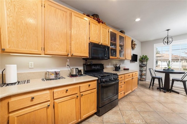 kitchen featuring light tile patterned floors, recessed lighting, light countertops, black appliances, and glass insert cabinets