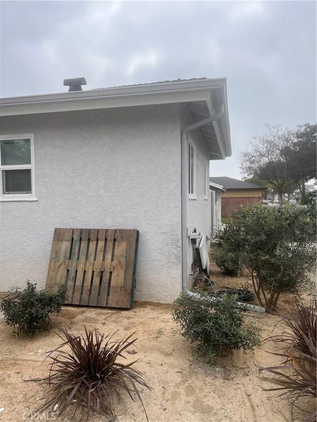 view of home's exterior with stucco siding