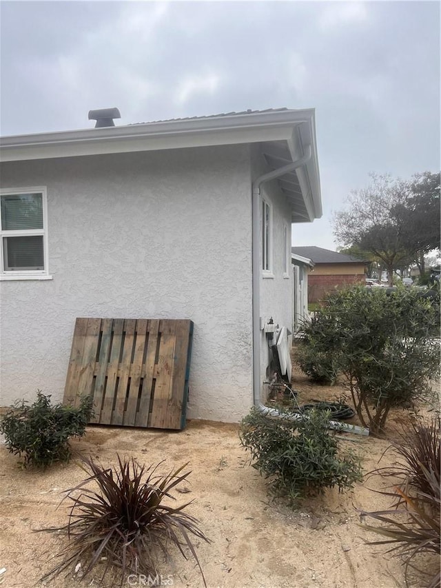 view of home's exterior with stucco siding