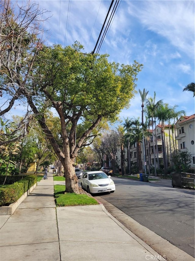 view of road with curbs and sidewalks