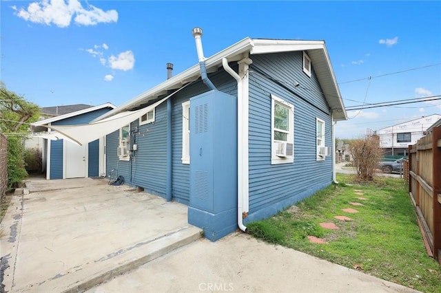 exterior space featuring a patio area and fence