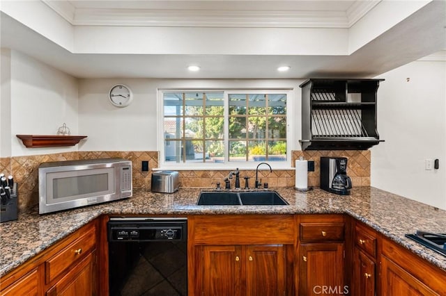 kitchen with a sink, black dishwasher, ornamental molding, tasteful backsplash, and stainless steel microwave