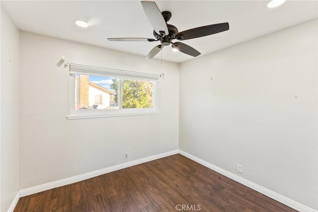 spare room with dark wood-style floors, recessed lighting, baseboards, and a ceiling fan