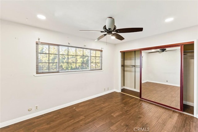 unfurnished bedroom with ceiling fan, recessed lighting, wood finished floors, baseboards, and a closet