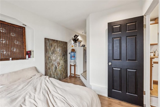 bedroom with wood finished floors