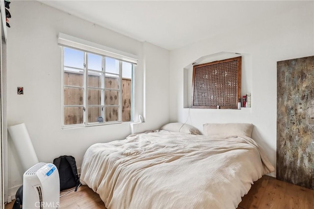 bedroom featuring wood finished floors