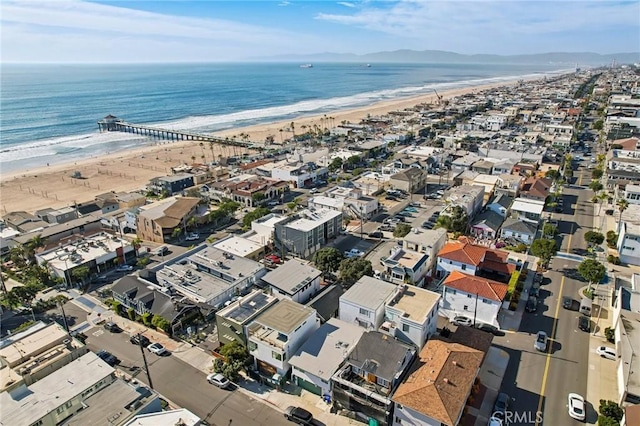 birds eye view of property with a beach view and a water view