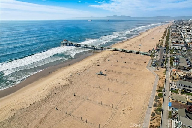 aerial view featuring a water view and a beach view