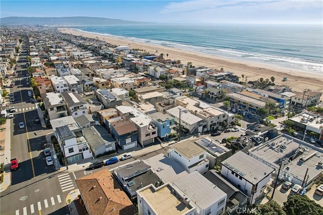 birds eye view of property with a view of the beach and a water view