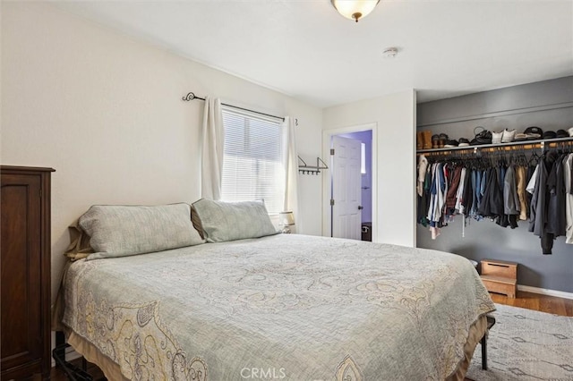 bedroom featuring a closet and wood finished floors