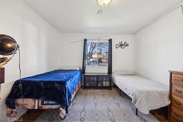 bedroom featuring lofted ceiling