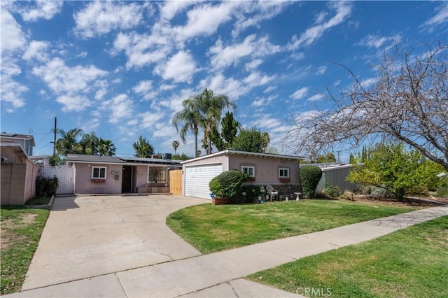 ranch-style home featuring stucco siding, solar panels, concrete driveway, a front yard, and fence