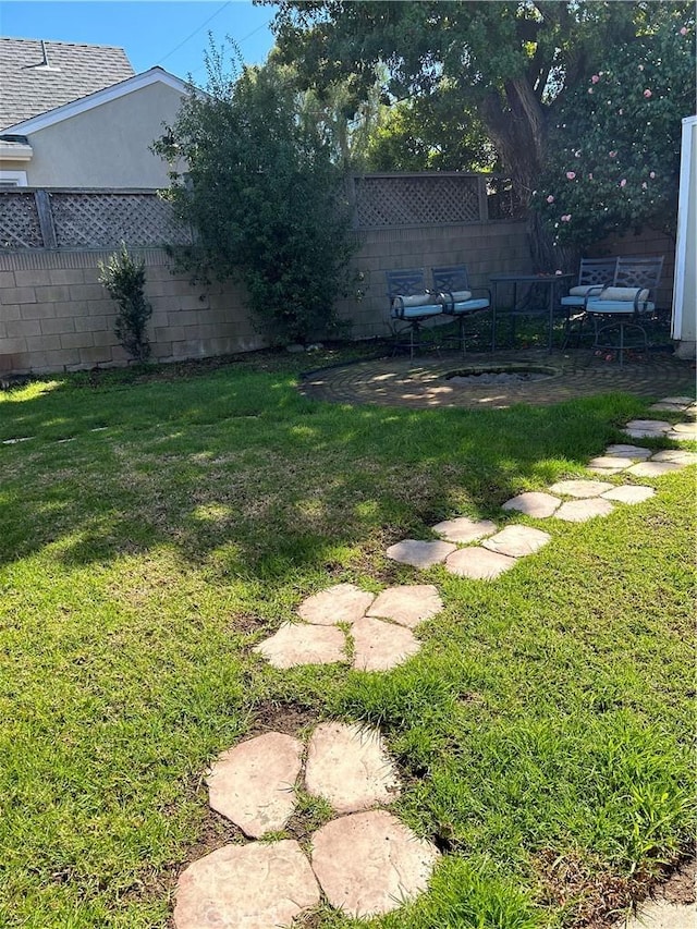 view of yard featuring fence private yard and a patio area