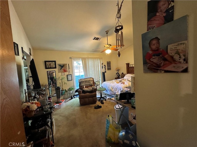 carpeted bedroom with ceiling fan and visible vents