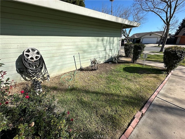 view of home's exterior with a yard