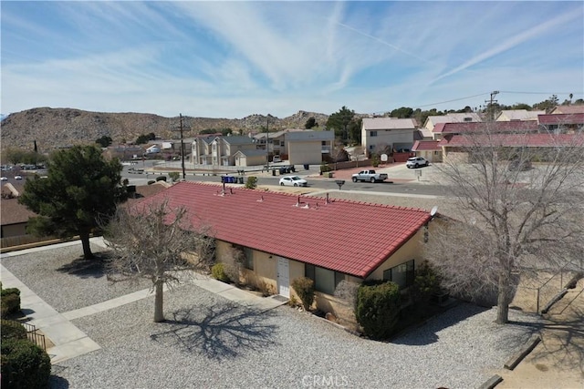 exterior space with a mountain view and a residential view