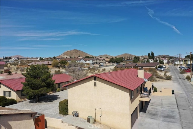 drone / aerial view featuring a mountain view and a residential view