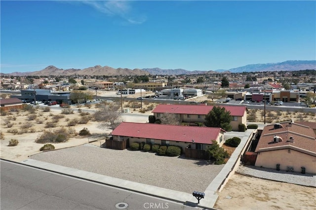 birds eye view of property featuring a mountain view