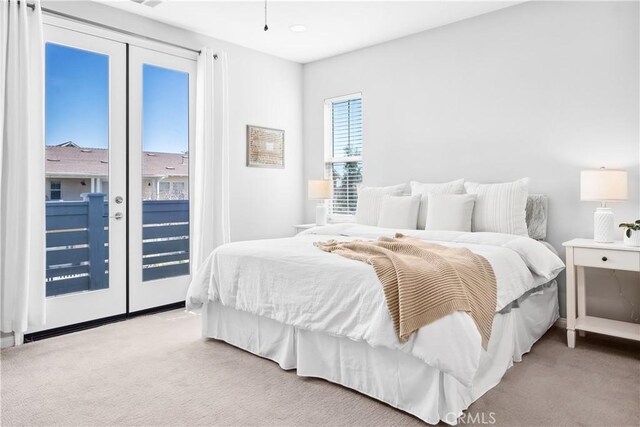 bedroom featuring carpet floors and access to outside