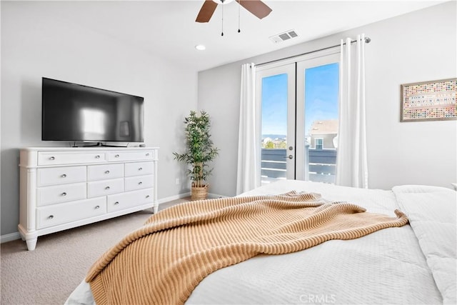 bedroom with access to exterior, carpet, visible vents, and baseboards