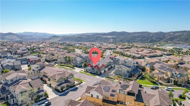 drone / aerial view with a residential view and a mountain view