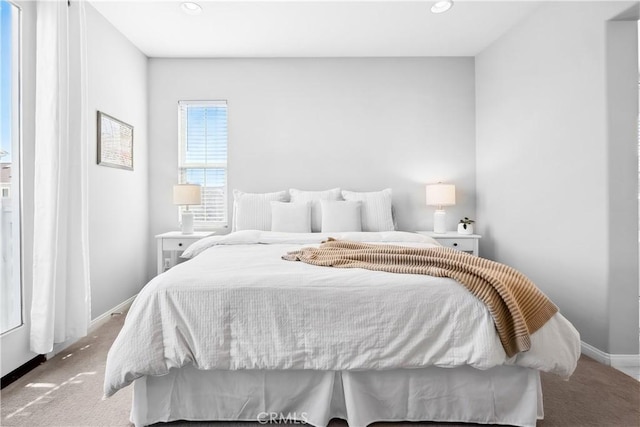 carpeted bedroom with recessed lighting and baseboards