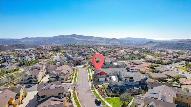 drone / aerial view with a mountain view and a residential view