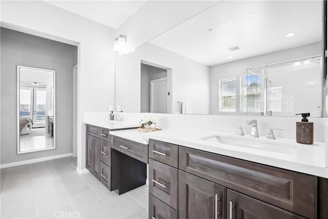 full bath featuring ensuite bathroom, vanity, visible vents, a shower stall, and tile patterned floors