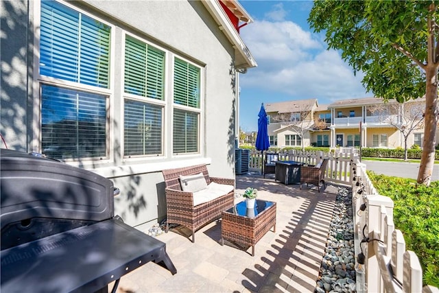 balcony with a patio area, a residential view, and outdoor lounge area