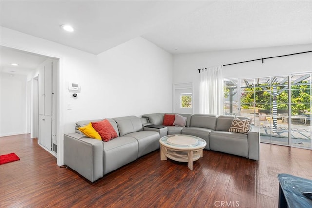 living room with recessed lighting, vaulted ceiling, and wood finished floors