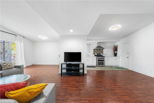 living room with dark wood finished floors and baseboards