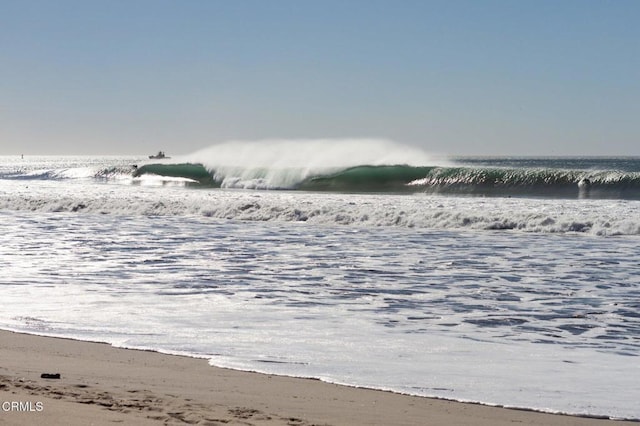 property view of water featuring a beach view