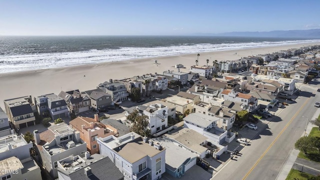 aerial view with a water view, a residential view, and a view of the beach