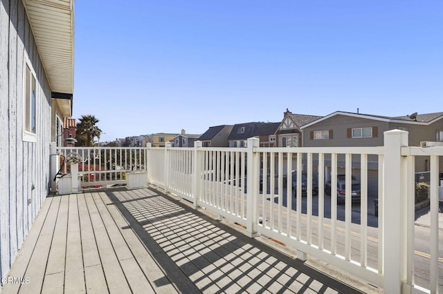 wooden terrace featuring a residential view