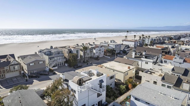 bird's eye view featuring a water view, a residential view, and a beach view