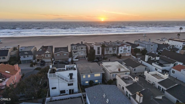 aerial view featuring a water view, a residential view, and a view of the beach