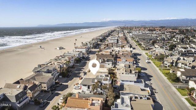 bird's eye view with a view of the beach and a water view