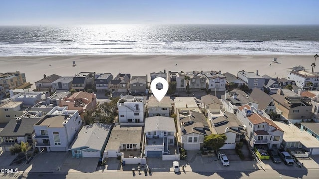 bird's eye view featuring a water view, a residential view, and a view of the beach