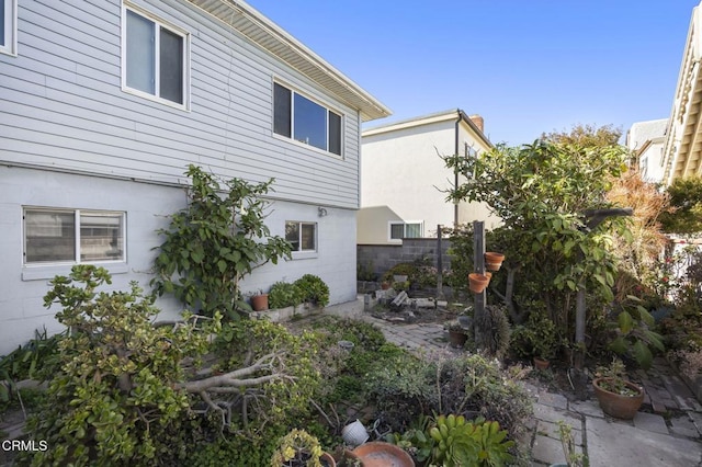 view of home's exterior featuring fence