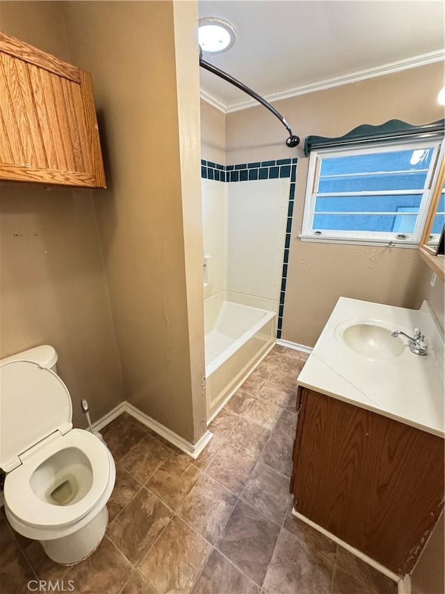 full bath featuring toilet, baseboards, crown molding, and vanity