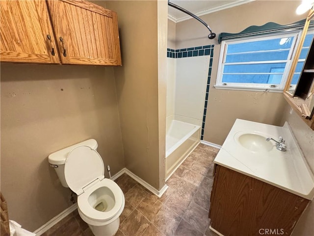 bathroom featuring baseboards, bathing tub / shower combination, toilet, crown molding, and vanity