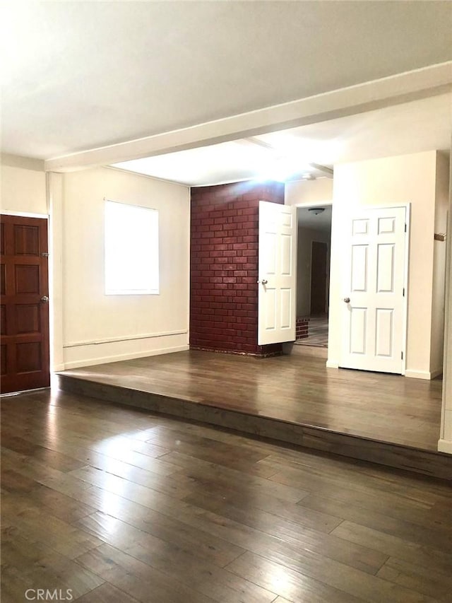 unfurnished room featuring hardwood / wood-style flooring