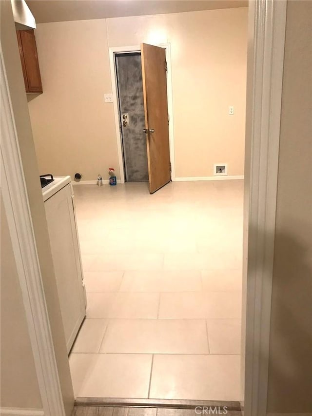 interior space with baseboards, visible vents, and washer / clothes dryer