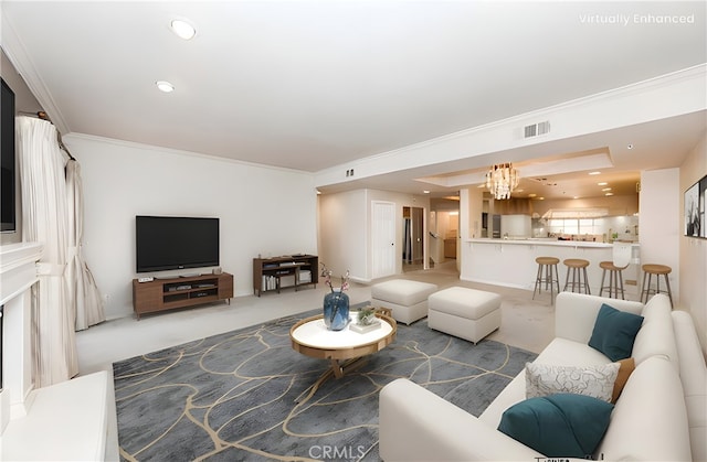 carpeted living room featuring a notable chandelier, recessed lighting, visible vents, and crown molding