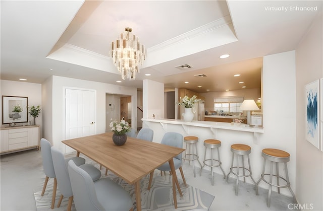 dining room featuring recessed lighting, visible vents, an inviting chandelier, a raised ceiling, and crown molding