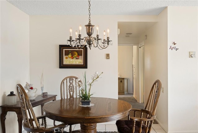 660 Avenida Sevilla Unit P, Laguna Woods, CA 92637 - dining area with a chandelier and light tile patterned floors