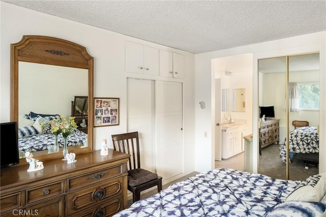 660 Avenida Sevilla Unit P, Laguna Woods, CA 92637 - bedroom with a closet, light colored carpet, and a textured ceiling