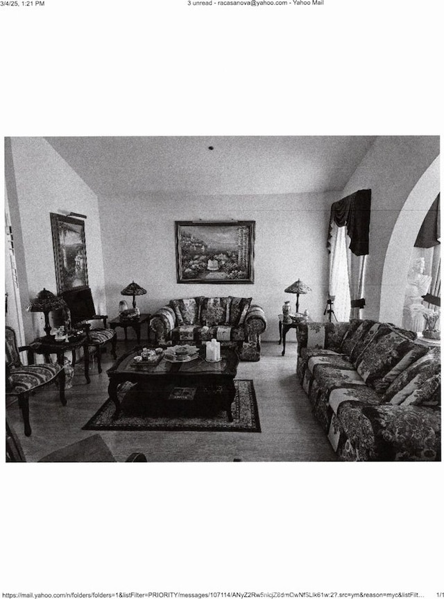 living area featuring arched walkways